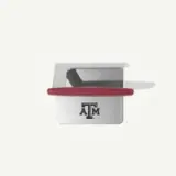 A silver metal device with a red handle prominently featuring the Texas A&M logo.