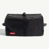 A black duffel bag with a simple design and a "MADE IN" label on the front.