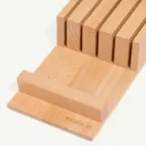 A wooden knife block with multiple slots for knife storage is shown.