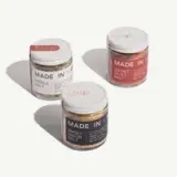 Three jars of gourmet salt blends labeled "Pickle Salt," "Smoky Onion Salt," and "Secret Sauce Salt" with sleek, minimalistic packaging.