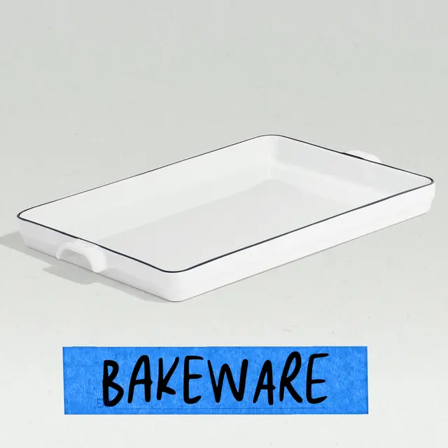 A rectangular white bakeware dish with a thin black border and side handles sits against a light background, accompanied by a blue label that reads "BAKEWARE."