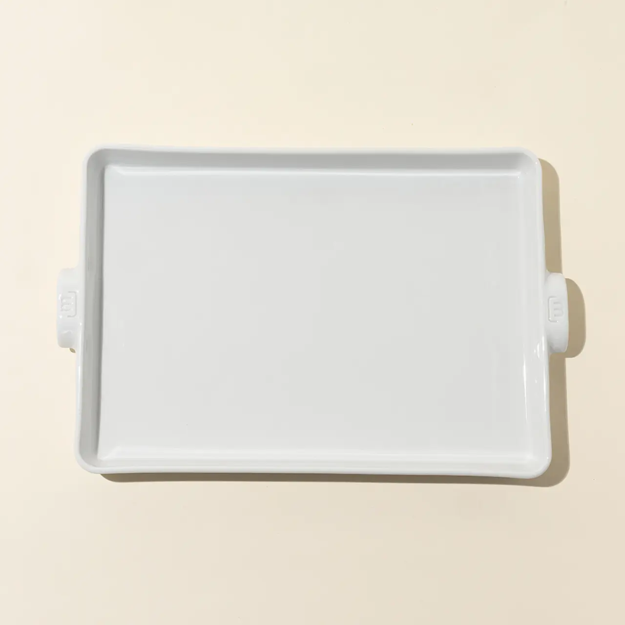 A blank white tray is shown against a neutral background.