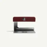 A red and silver bottle opener with a logo on the handle, designed for easy grip and functionality.