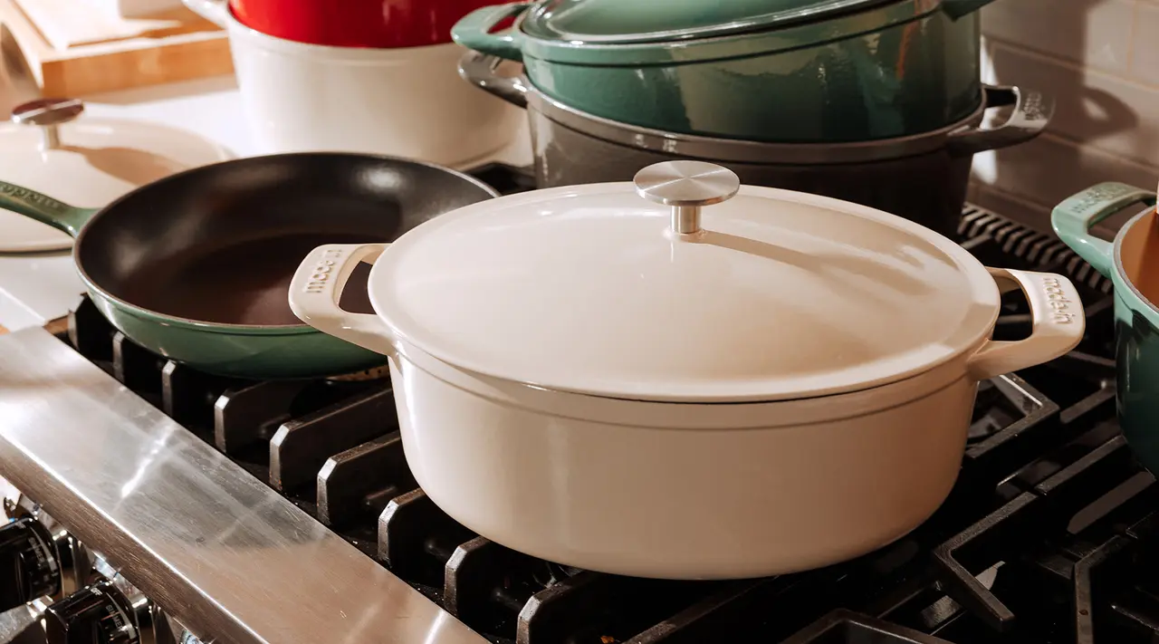 antique white dutch oven on stove