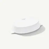 A white, oval-shaped ceramic dish is shown upside down, with two handles visible on either side.