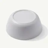 A simple, light gray bowl with a smooth surface and rounded edges.