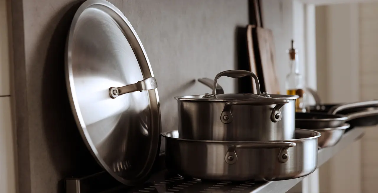 stainless steel cookware on shelf