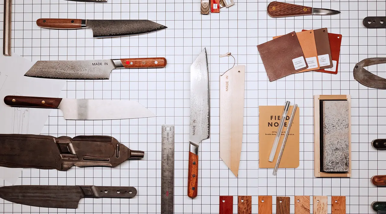 Various kitchen knives and sharpening tools are organized neatly on a grid background.