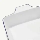 A white rectangular ceramic dish with the words "Made In" embossed on the side.