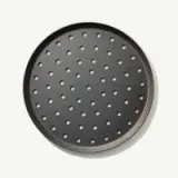 A round pizza baking tray with perforated holes is shown.