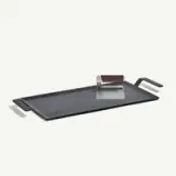 A rectangular griddle pan with handles and a metal grill press is shown against a white background.