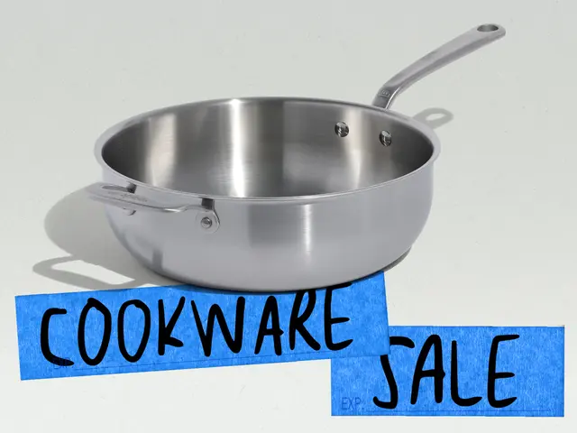 A stainless steel skillet is prominently displayed alongside bold text advertising a cookware sale.