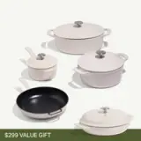 A collection of five cooking pots and pans in neutral colors, featuring various sizes and styles.