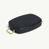 A sleek black rectangular container with gold handles, designed for cooking or serving.