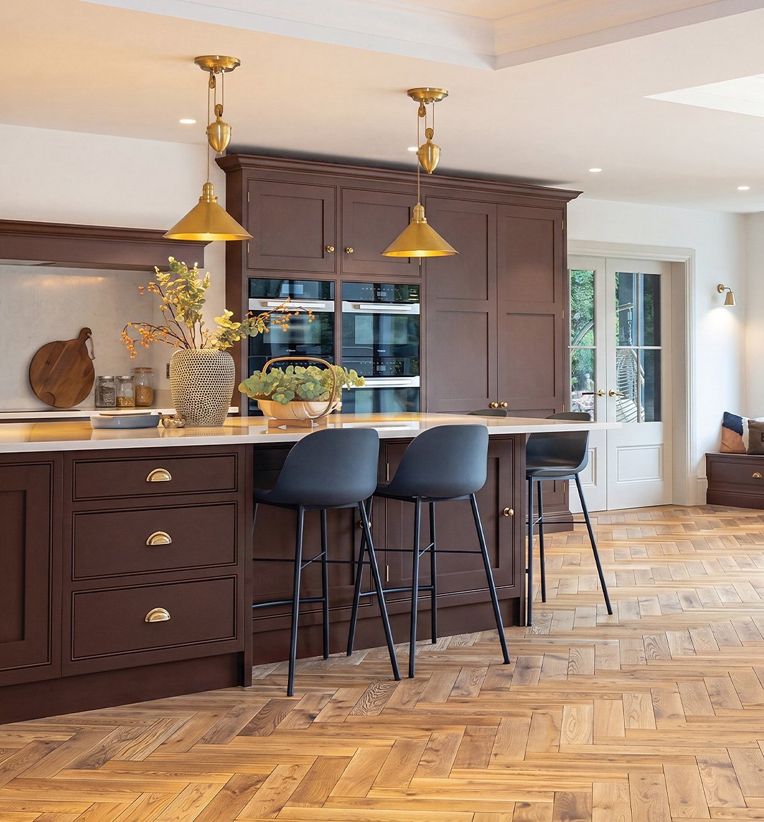 Crafted wood flooring across a sunlit kitchen space