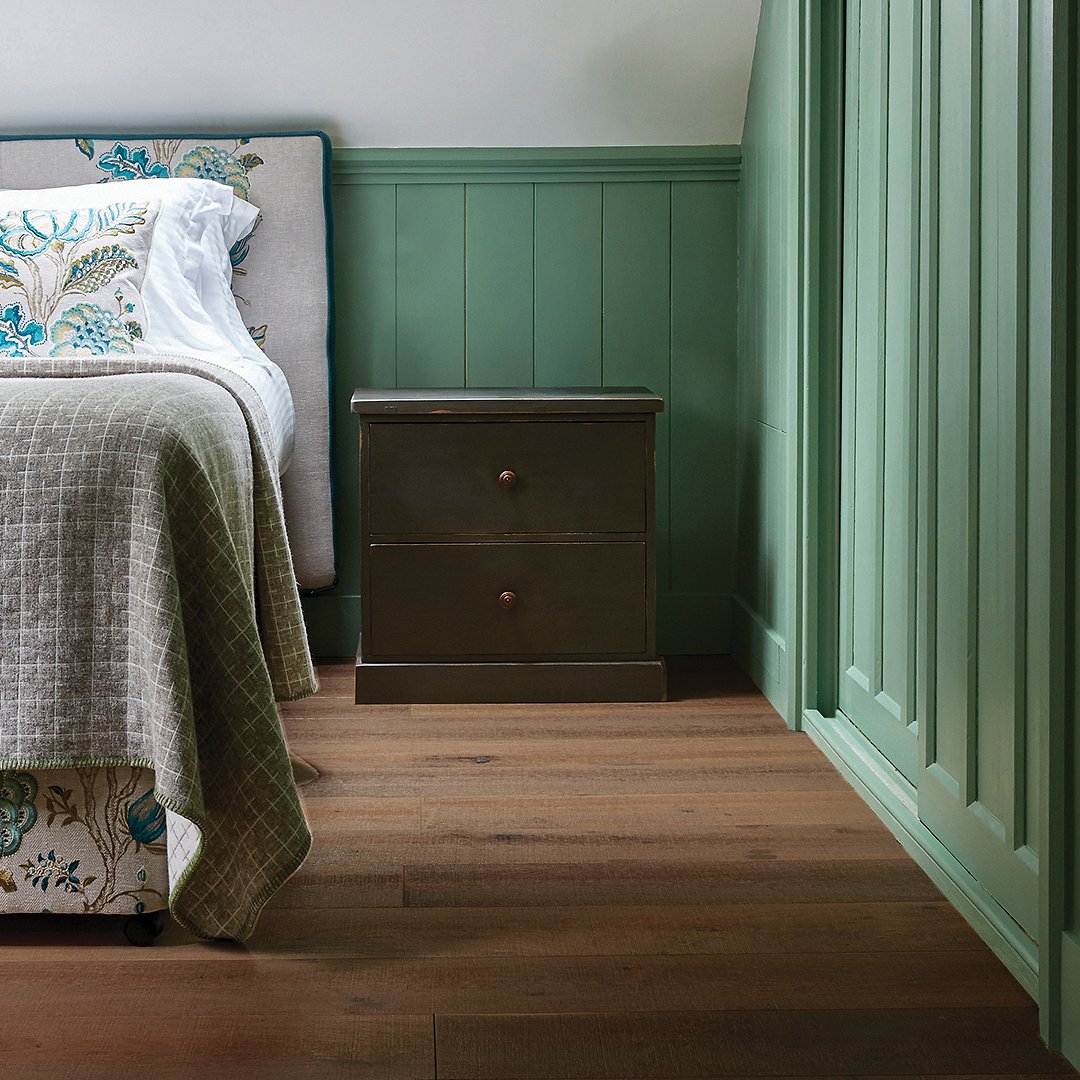 Plank wood flooring in a bedroom space