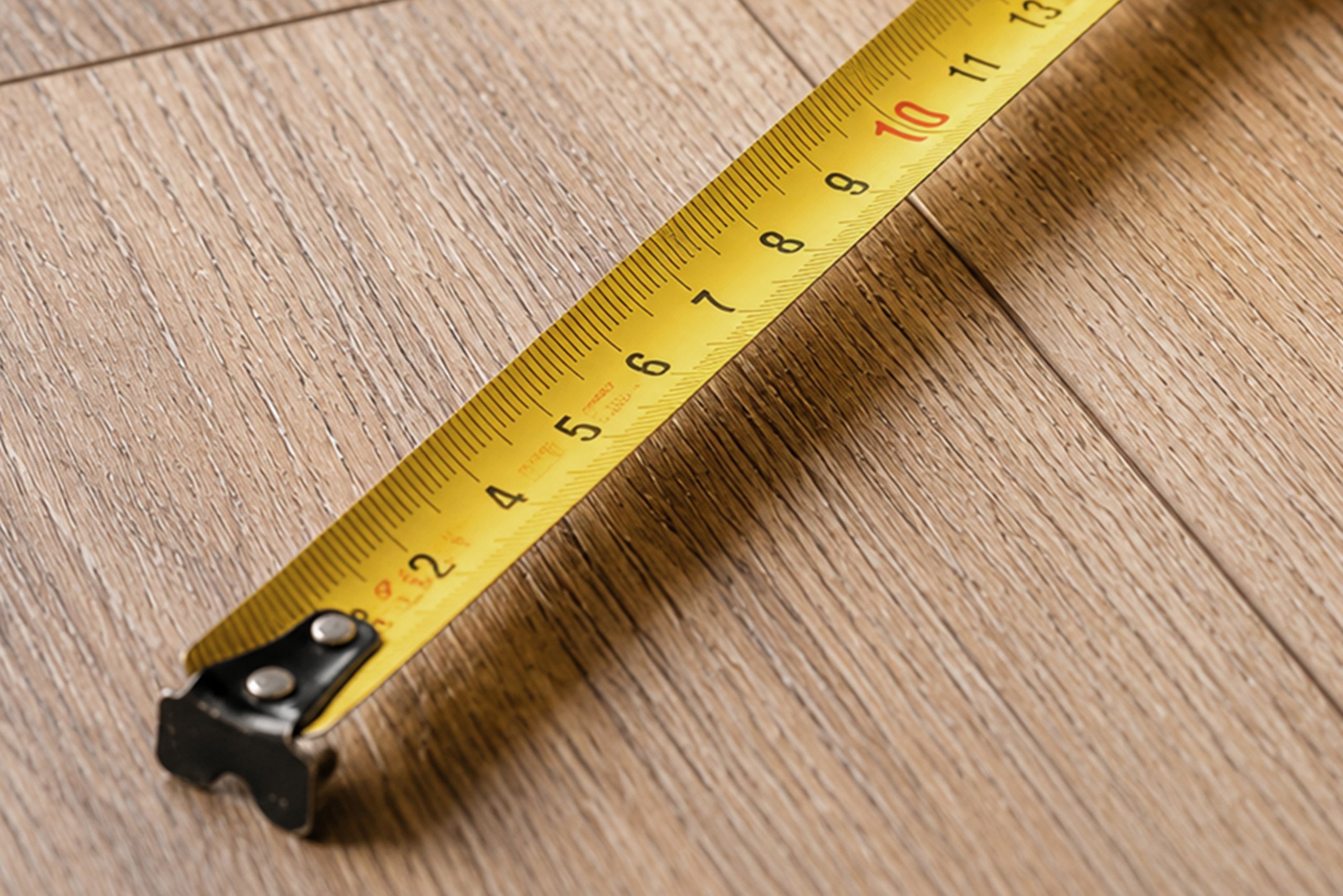 Wood flooring being measured for a project