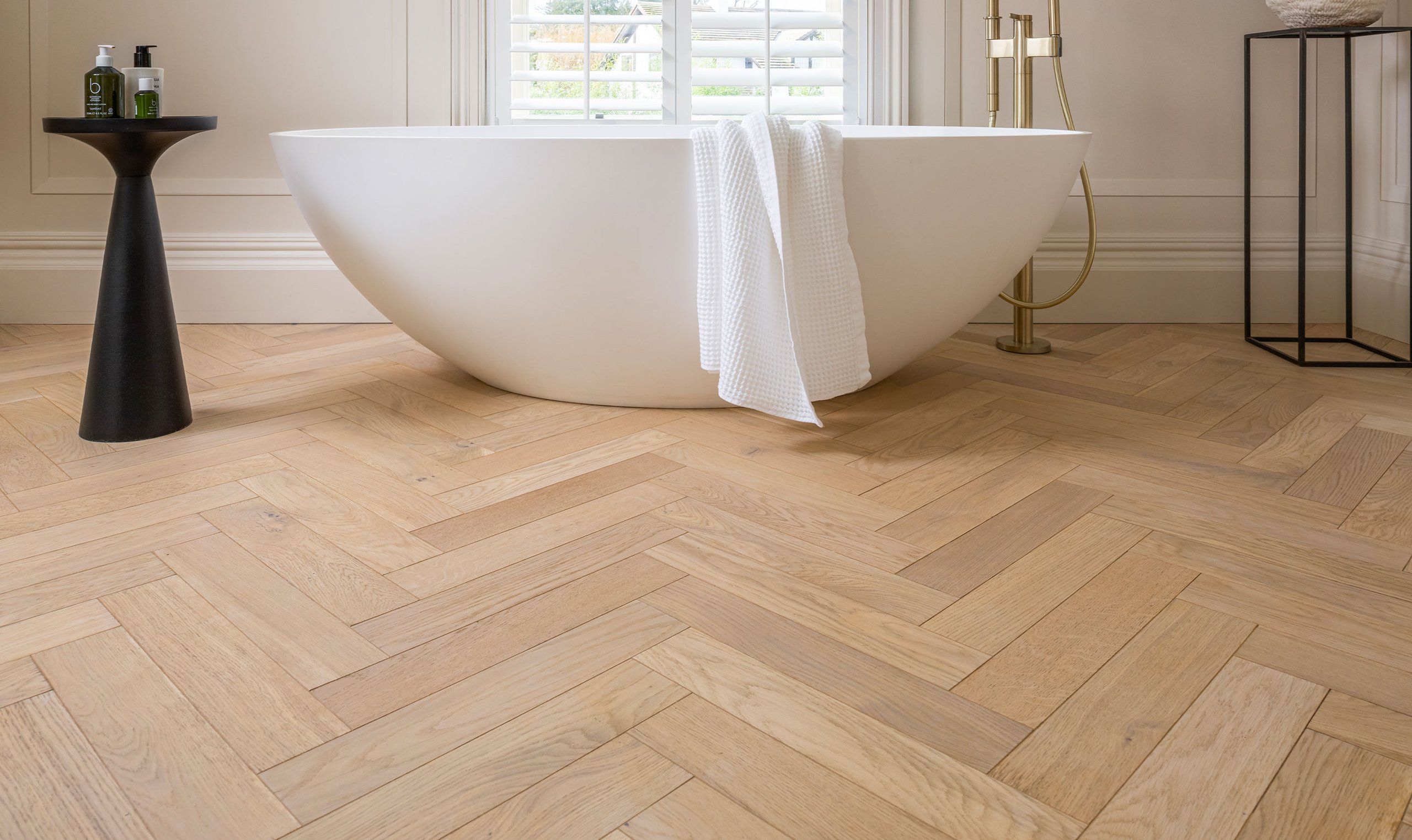 Bathroom with layered Ted Todd wood flooring