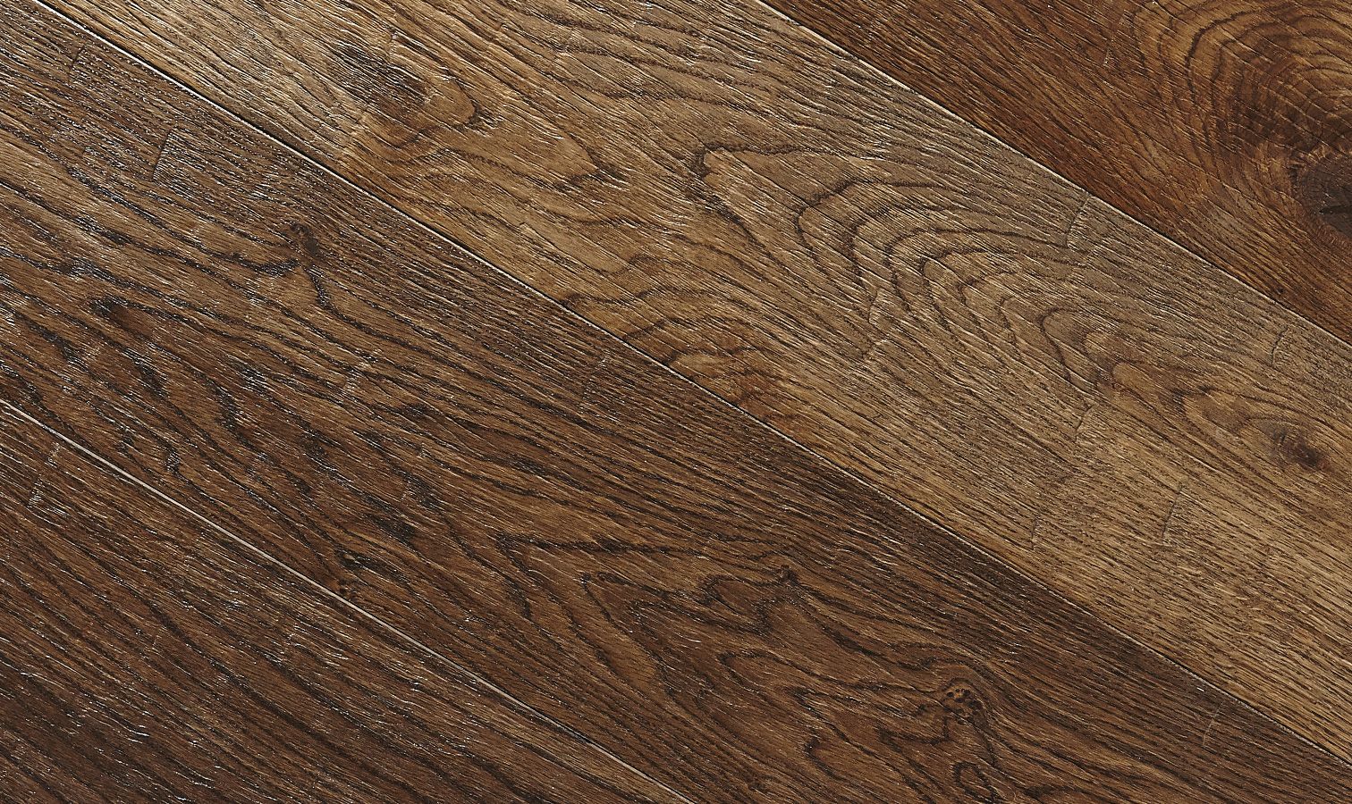 Close-up of deeply weathered oak floorboards with visible grain