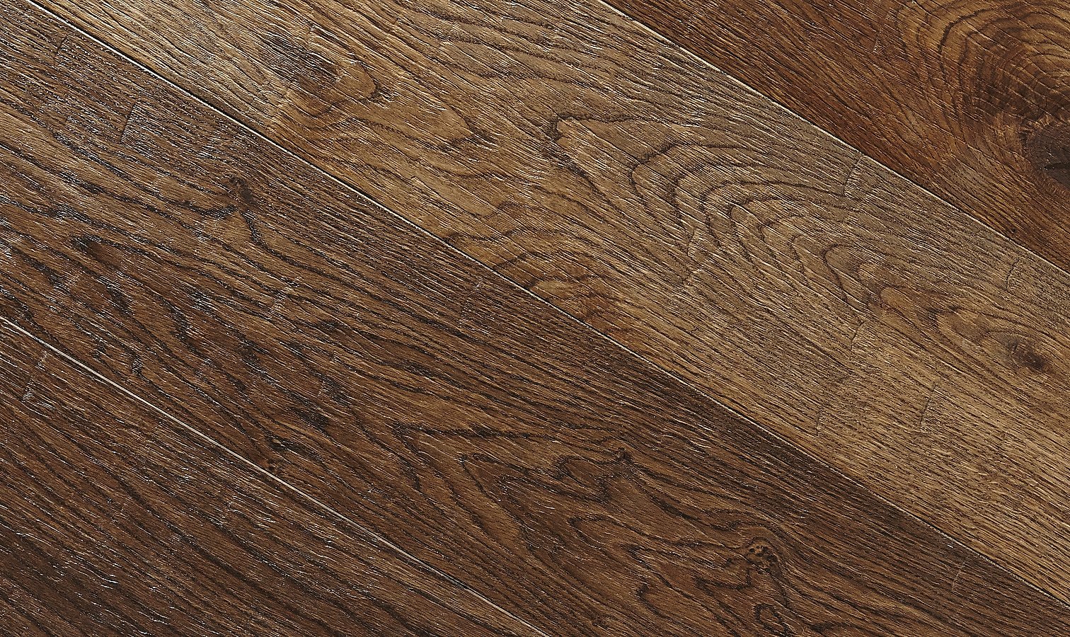 Close-up of deeply weathered oak floorboards with visible grain