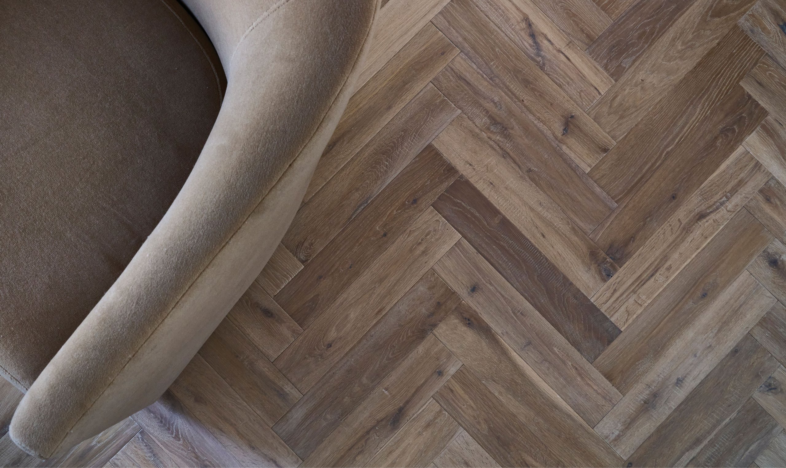 A Ted Todd herringbone floor laid through a living space
