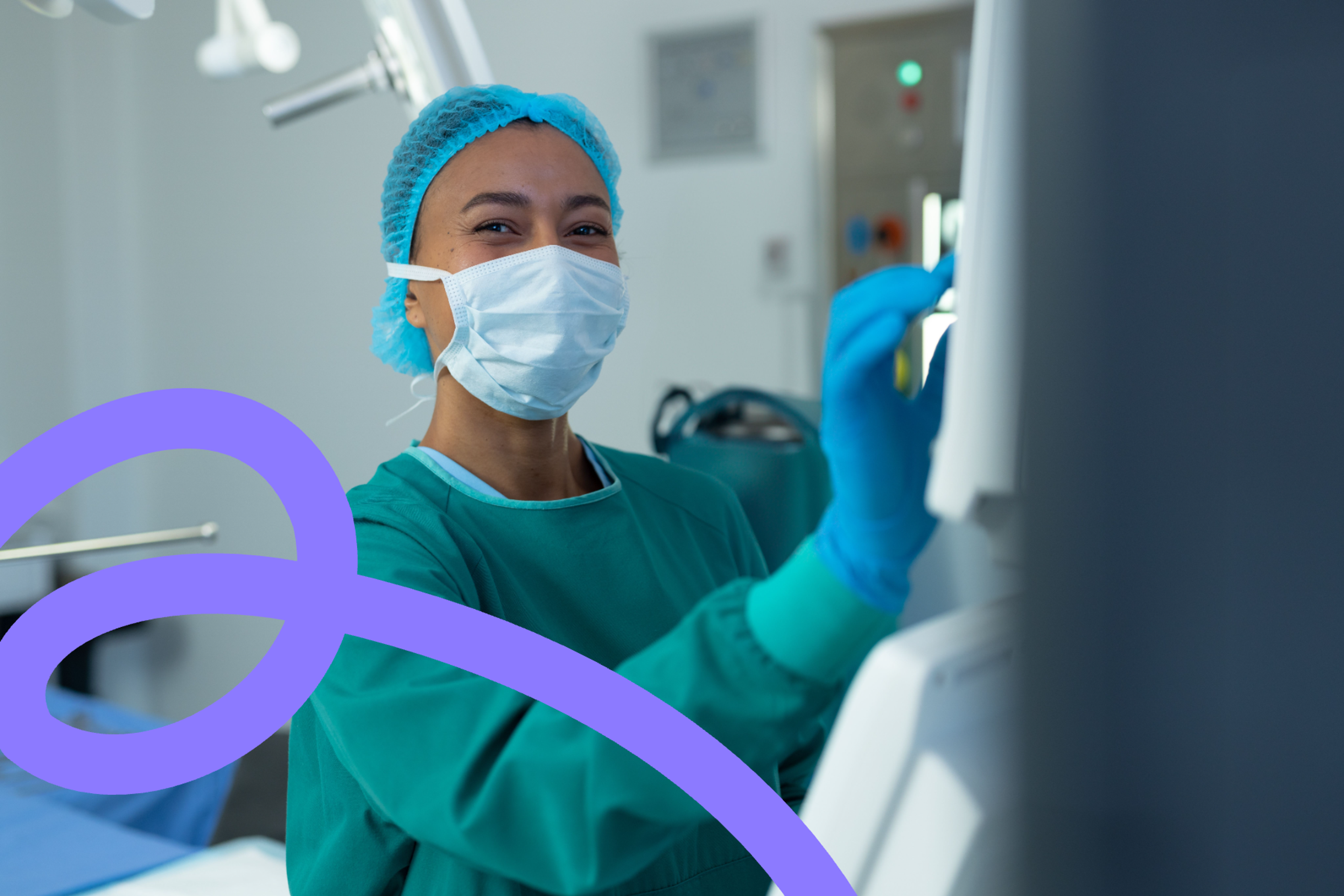 A nurse in a surgical cap, mask, and gown adjusting equipment in a hospital room