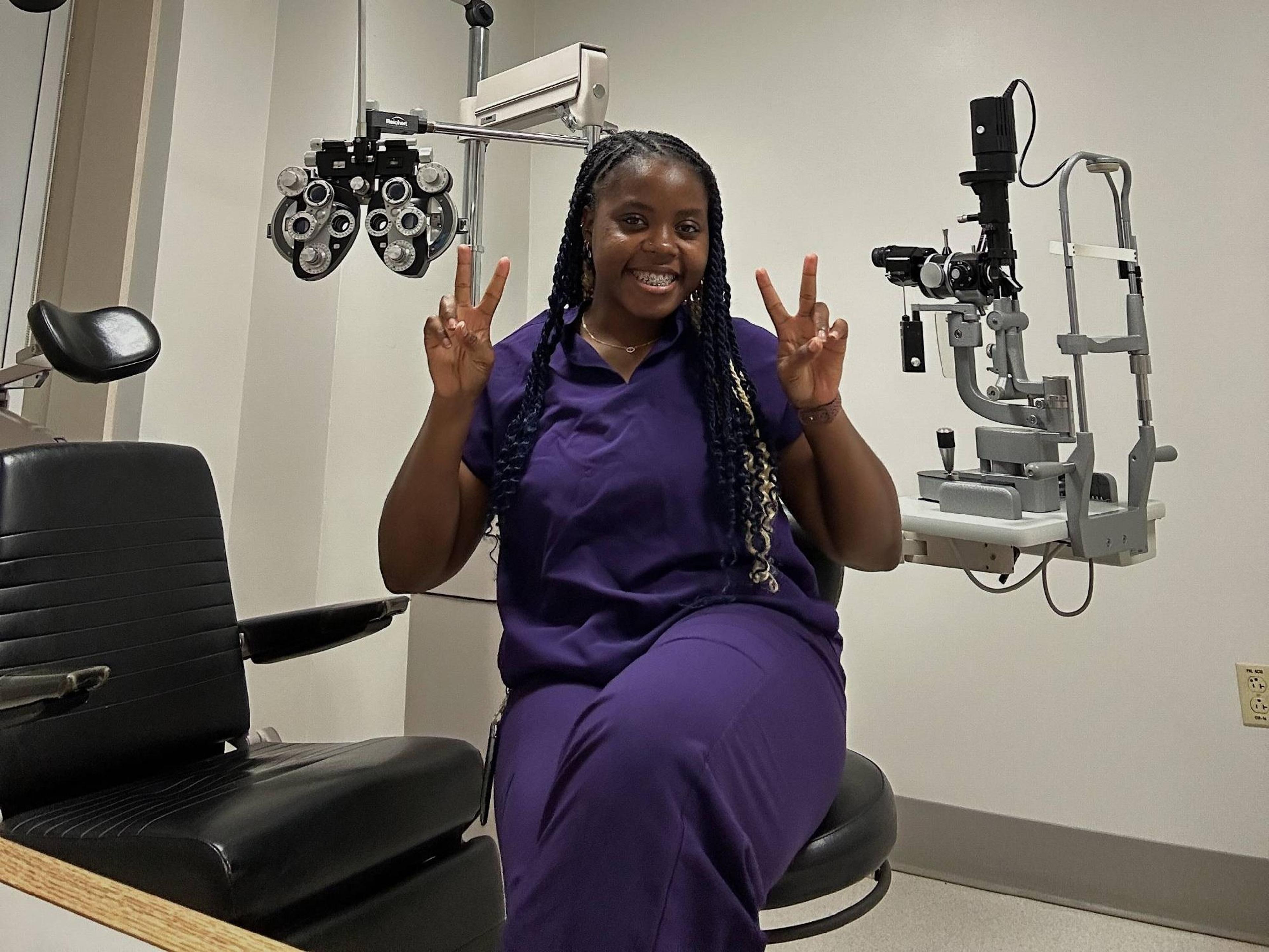 Optometry student in an exam room