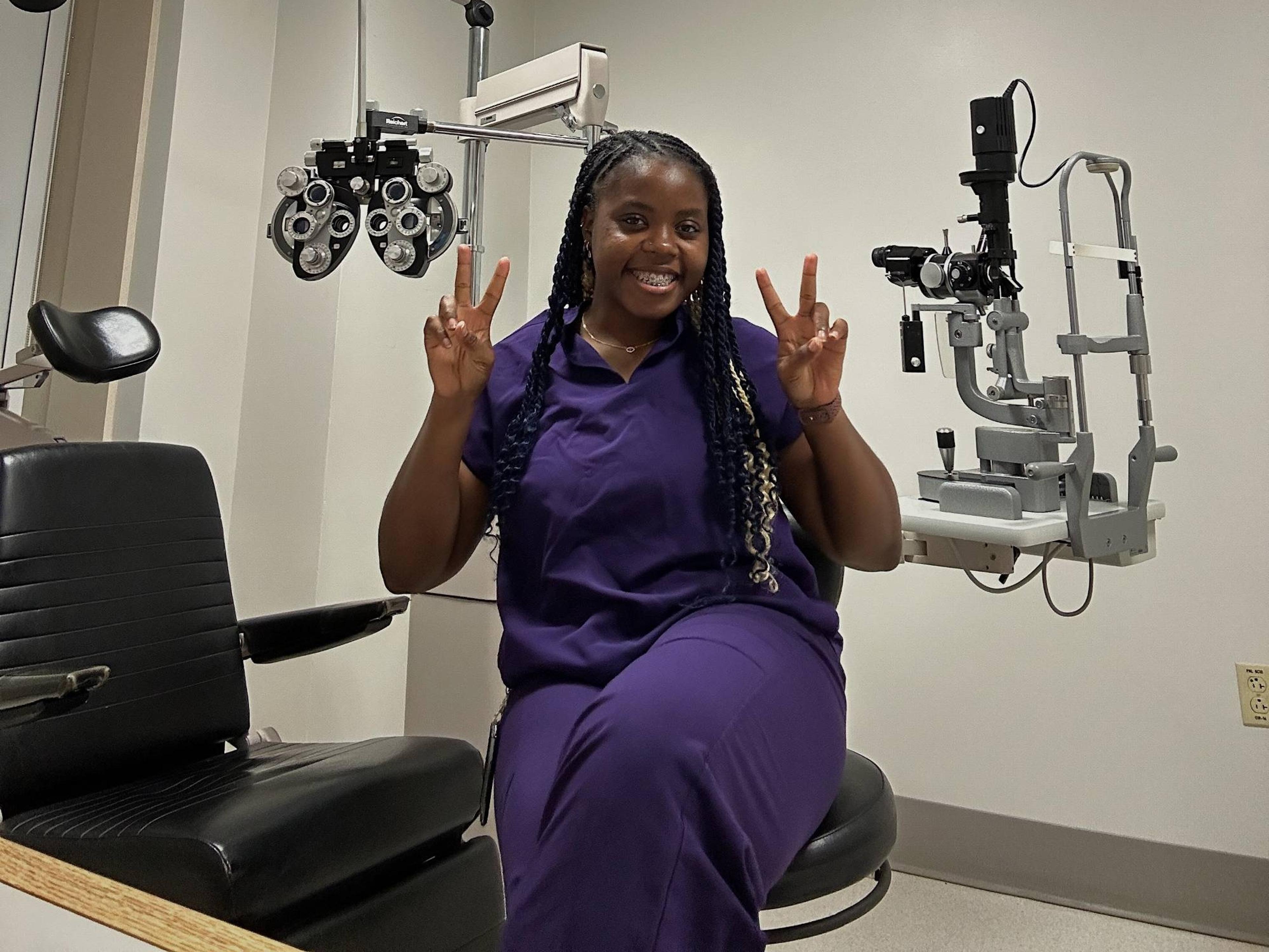 Optometry student in an exam room
