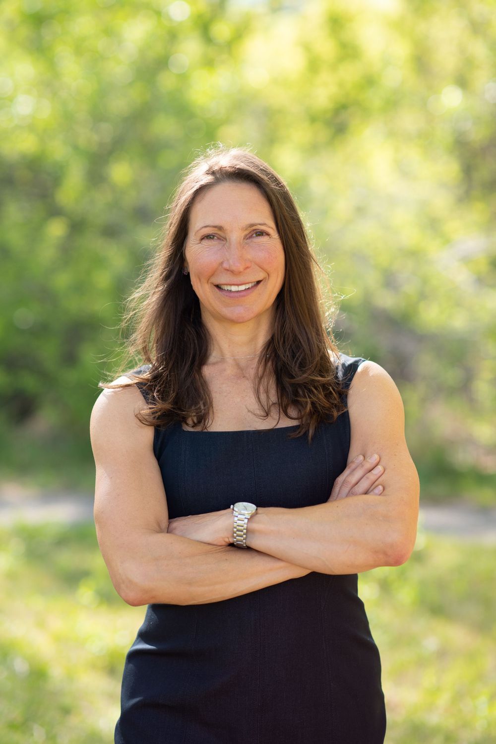 Karina Krepp standing surrounded by greenery ready to speak