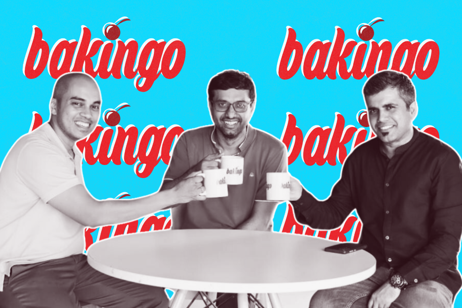 Three men seated around a table, holding white mugs with the "Bakingo" logo. The background is bright blue with the red "Bakingo" logo repeated, and the group is smiling in a casual, friendly setting.