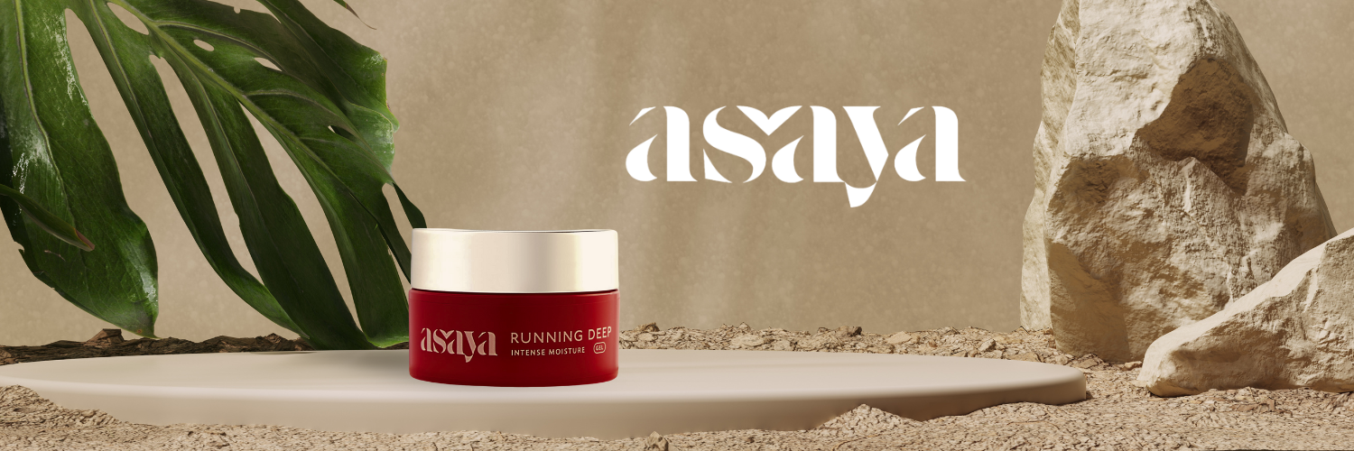 The image displays an Asaya skincare product on a minimalist background with a large green leaf and textured rocks, emphasizing the brand's natural aesthetic.