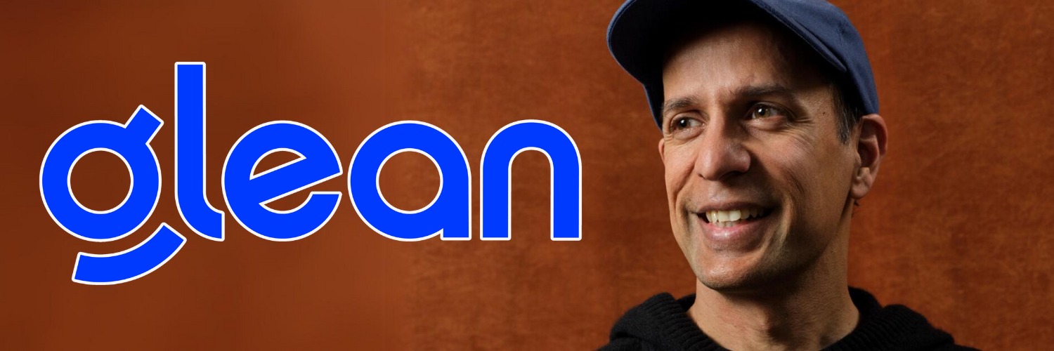A man wearing a blue cap and black sweater smiles warmly against a brown background. The text "Glean" is prominently displayed in large blue and white letters to the left of the man.