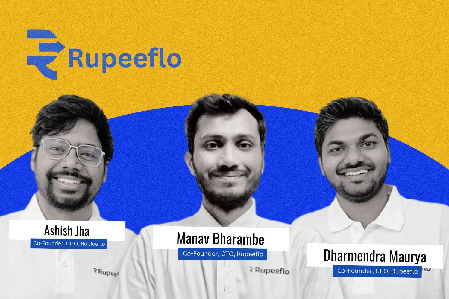 A group photo of three co-founders of Rupeeflo, all wearing white polo shirts with the company logo. The background is a mix of yellow and blue with the "Rupeeflo" logo prominently displayed. The co-founders have name tags: Ashish Jha (Co-Founder, COO), Manav Bharambe (Co-Founder, CTO), and Dharmendra Maurya (Co-Founder, CEO). Manav Bharambe’s image is in black and white, while the others are in full color.