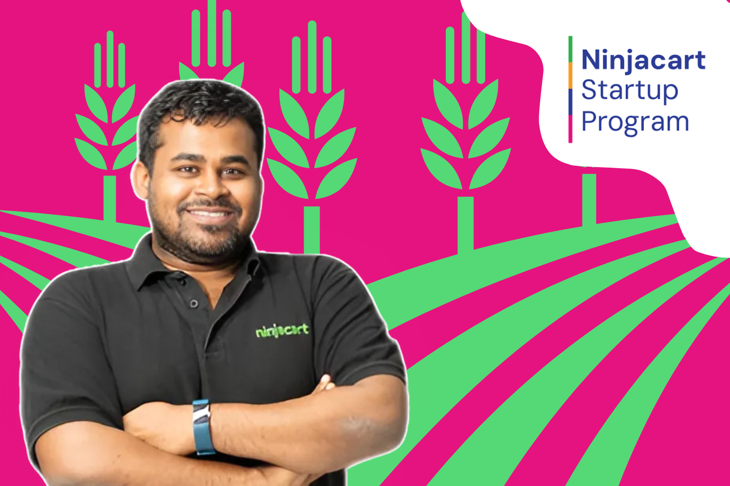 A smiling individual in a black "Ninjacart" polo stands with folded arms against a vibrant background of green crops and pink fields. The "Ninjacart Startup Program" logo is displayed in the top right corner.