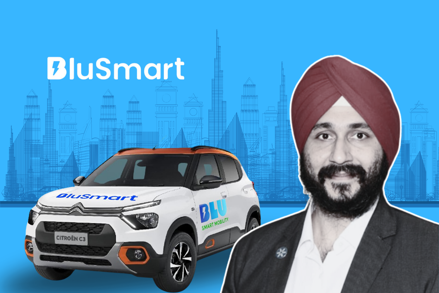 A man wearing a turban and a suit, smiling, with a BluSmart-branded Citroën C3 car in the foreground. The background features a city skyline in shades of blue, with the "BluSmart" logo prominently displayed.