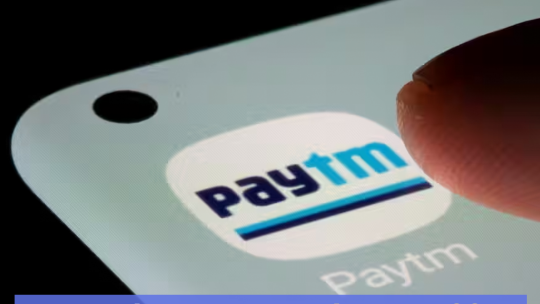 Image of a person clicking on Paytm icon on a phone, Text on top describing the fall of Paytm stock price below 400 rupees.