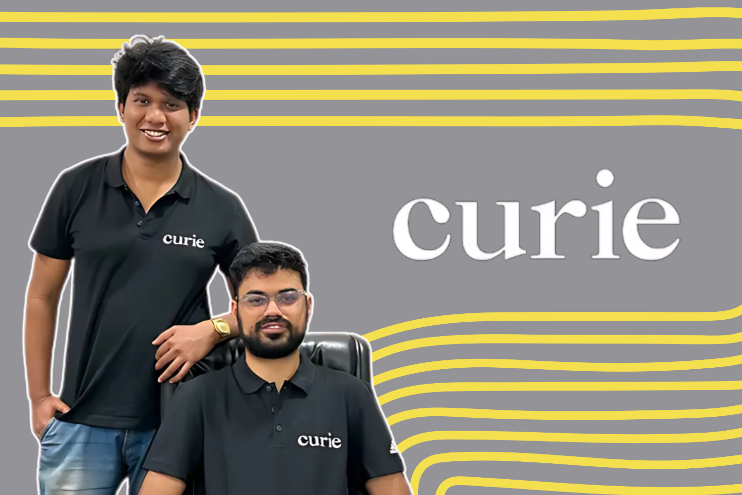 The image shows two individuals wearing black polo shirts with the "curie" logo on them. One person is standing, and the other is seated, with a clean gray background featuring yellow curved lines and the "curie" logo prominently displayed on the right side.