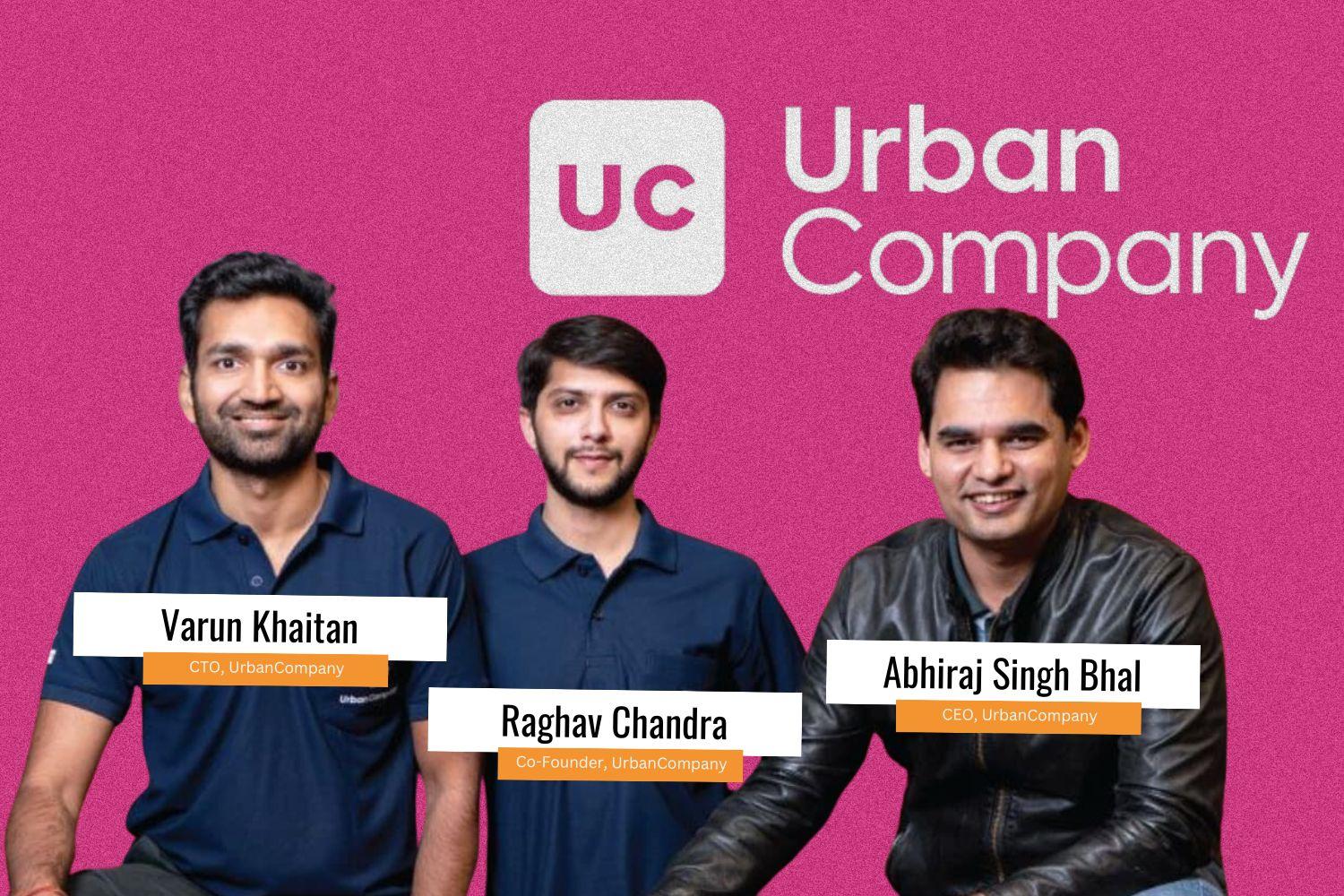 In front of a pink backdrop, three men pose together, with the phrase "Urban Company" prominently displayed behind them.