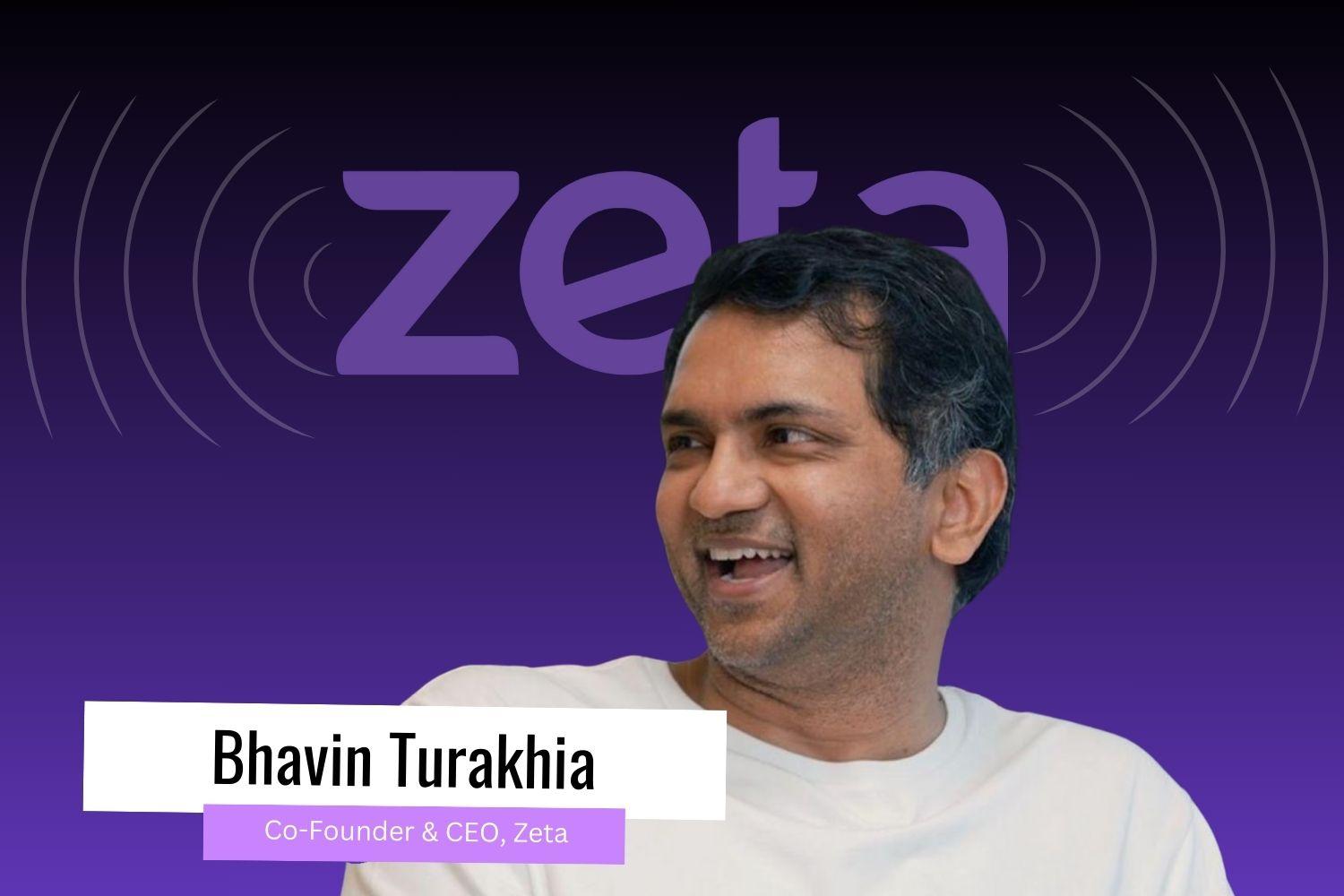 A digital graphic featuring Bhavin Turakhia, Co-Founder & CEO of Zeta. He is wearing a white t-shirt and smiling against a dark purple gradient background. The "Zeta" logo is displayed in large, semi-transparent text with circular wave patterns emanating from it. A name tag at the bottom highlights his name and title.