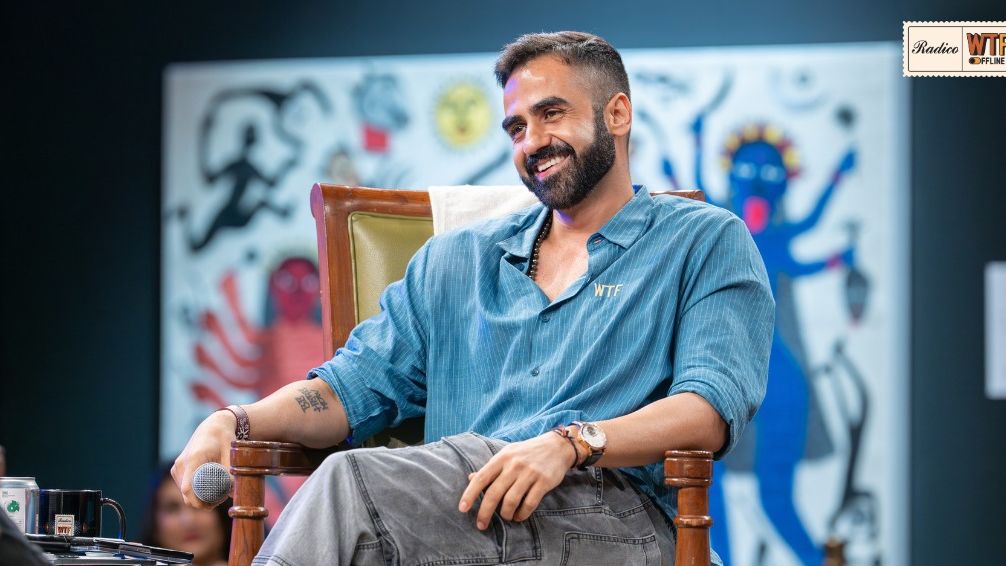 Nikhil Kamath sitting on a chair during his WTF show