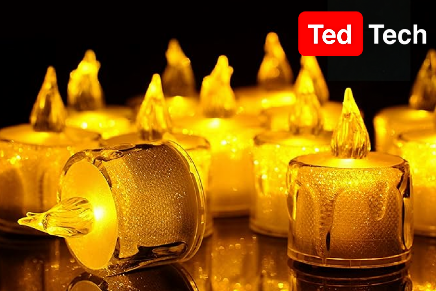 The image shows several small, LED tea light candles with warm yellow-orange flames, creating a cozy, glowing effect against a dark background. The candles have a realistic flame design with some featuring textured surfaces that mimic melted wax. In the upper right corner, the logo "Ted Tech" is displayed in a black rectangle, with "Ted" in a red box and "Tech" in white text.