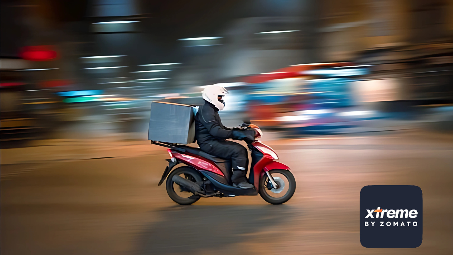 A delivery rider on a red scooter speeds through a dimly lit alley, carrying a large delivery bag. The Zomato Xtreme logo is featured in the corner, highlighting the brand's commitment to efficient delivery services.