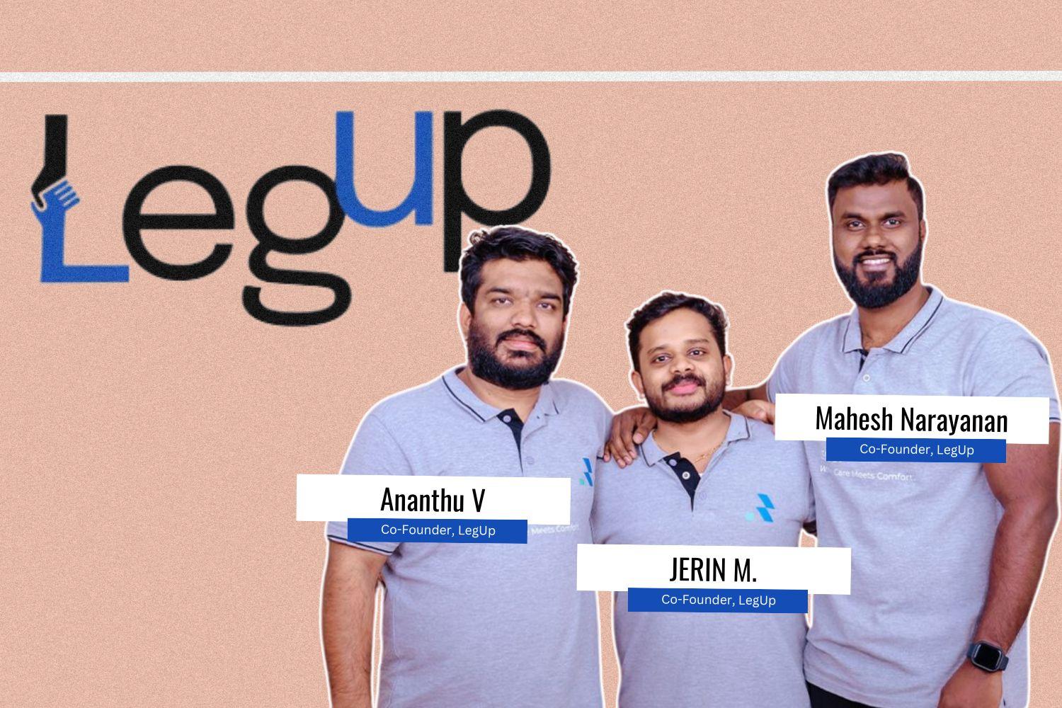 A group photo of three co-founders of LegUp, wearing matching light gray polo shirts with the company logo. The background features the "LegUp" logo in black and blue with a stylized "L" incorporating a helping hand graphic. Each co-founder has a name tag: Ananthu V, Jerin M., and Mahesh Narayanan, all labeled as Co-Founders of LegUp.