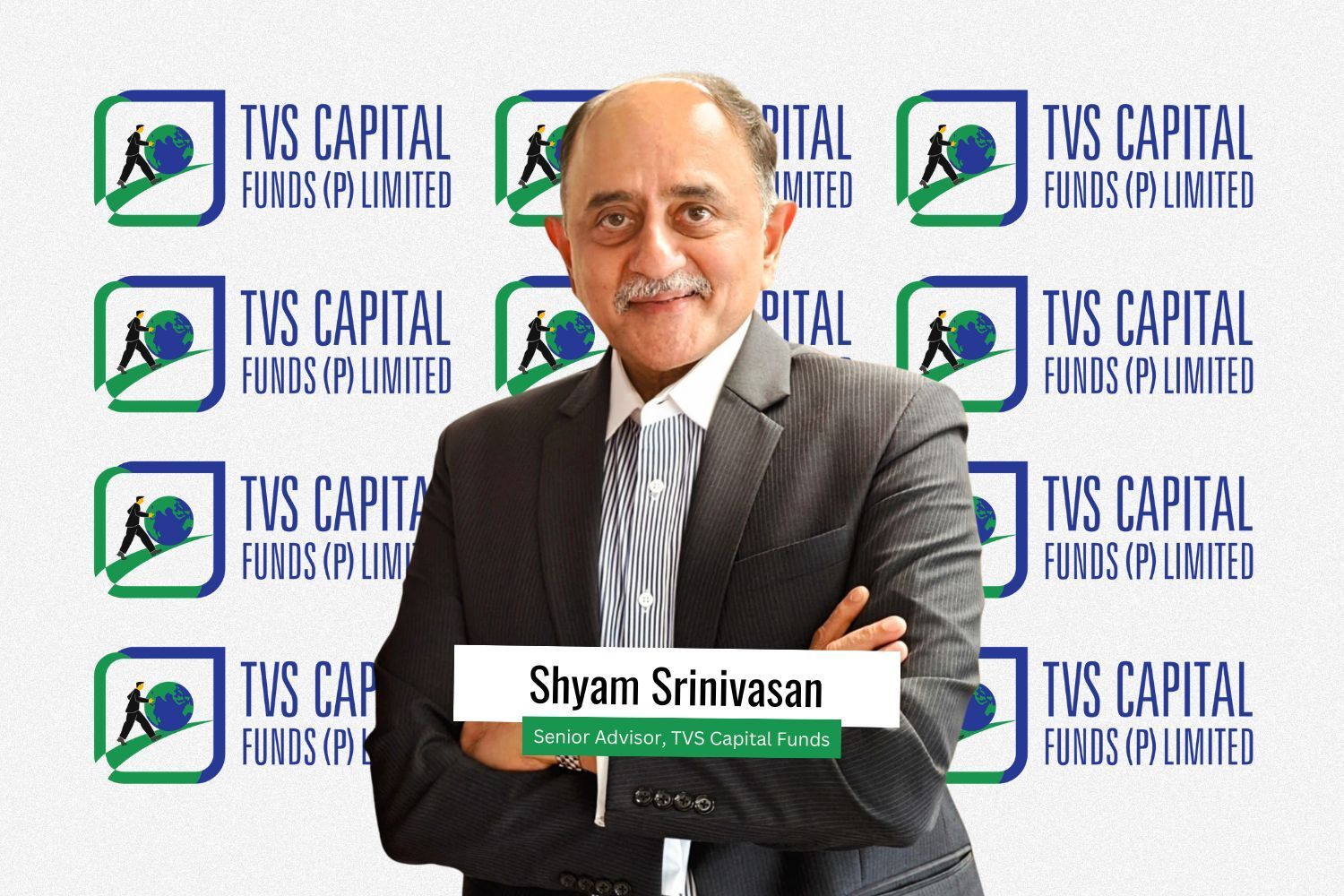 Shyam Srinivasan, newly appointed Senior Advisor at TVS Capital Funds, stands confidently in a suit with arms crossed, smiling against a backdrop featuring multiple TVS Capital Funds (P) Limited logos.