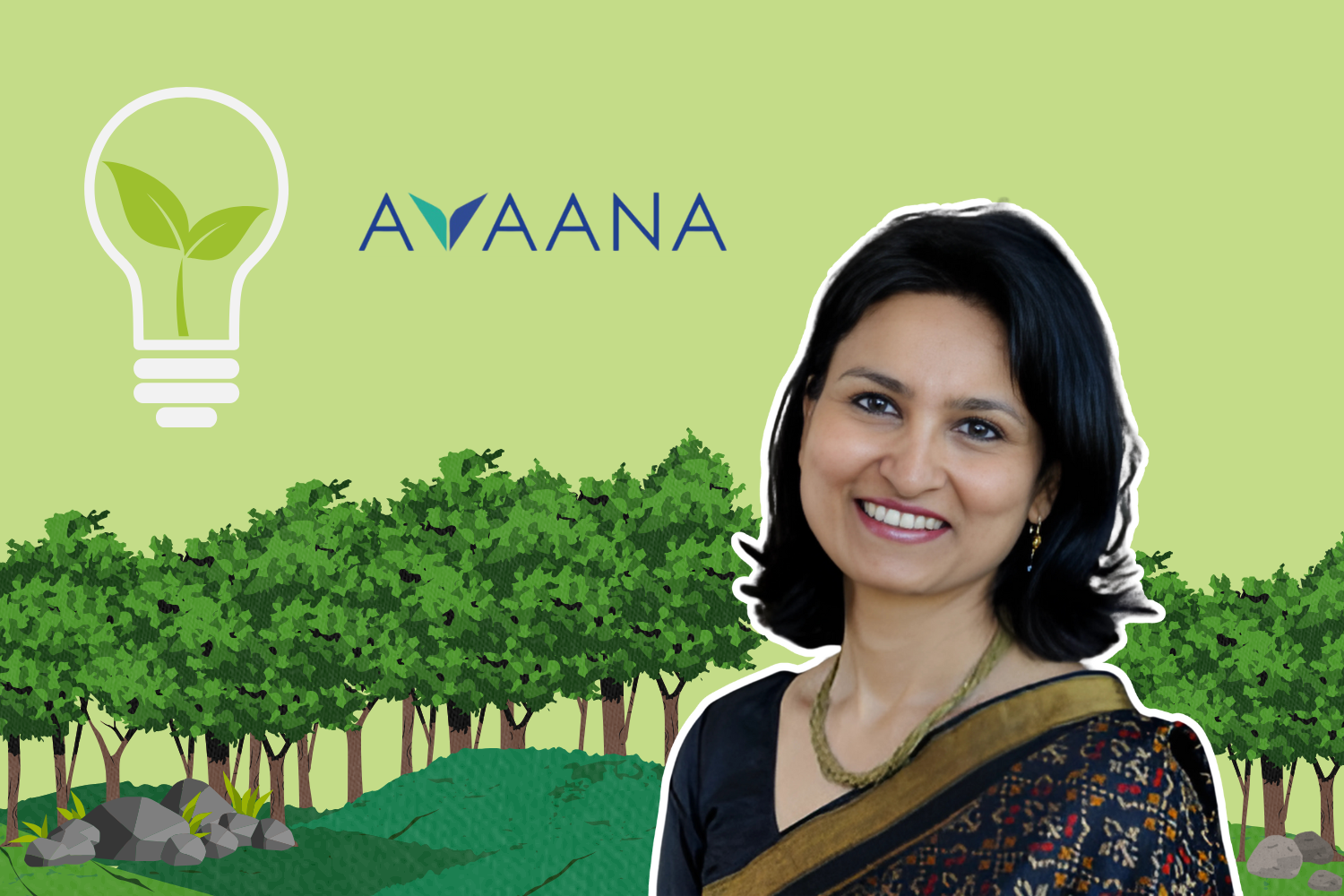The image shows a woman smiling, with short black hair, wearing a black sari with a gold border. In the background is a graphic design of trees, a lightbulb with a green leaf inside, and the logo "AVAANA."