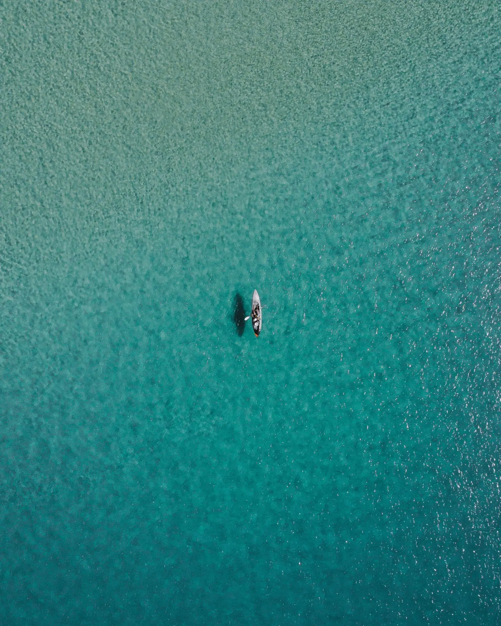 ocean shot of single kayak