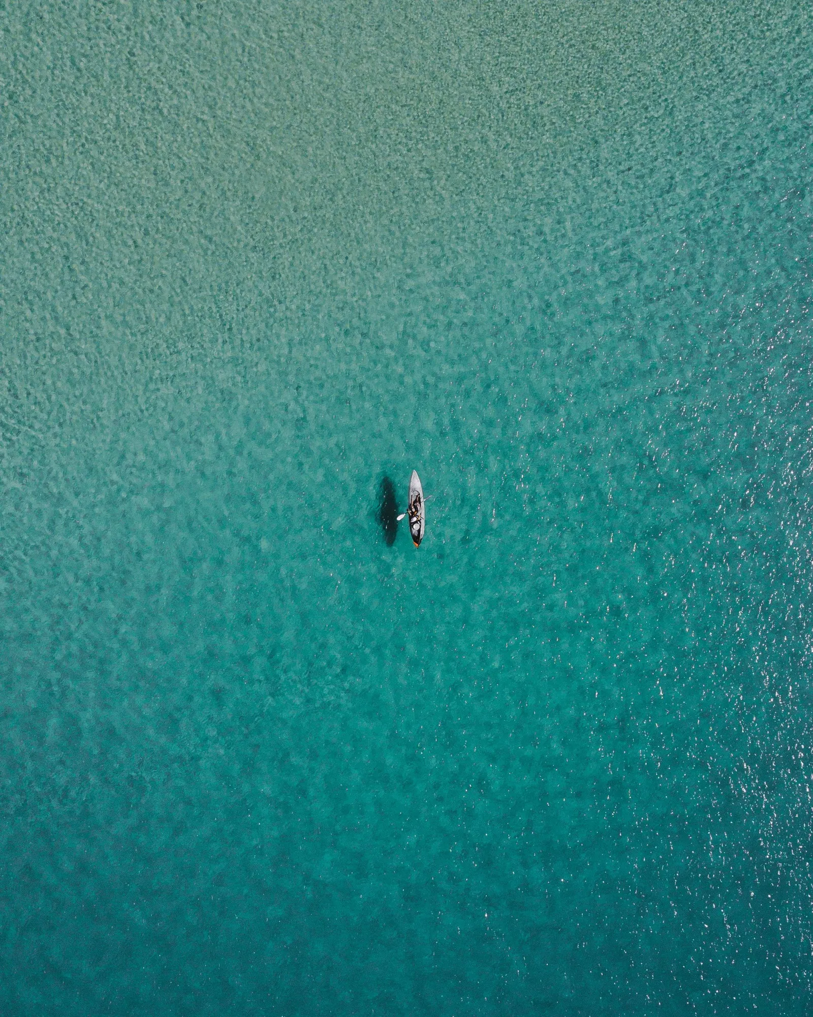 ocean shot of single kayak