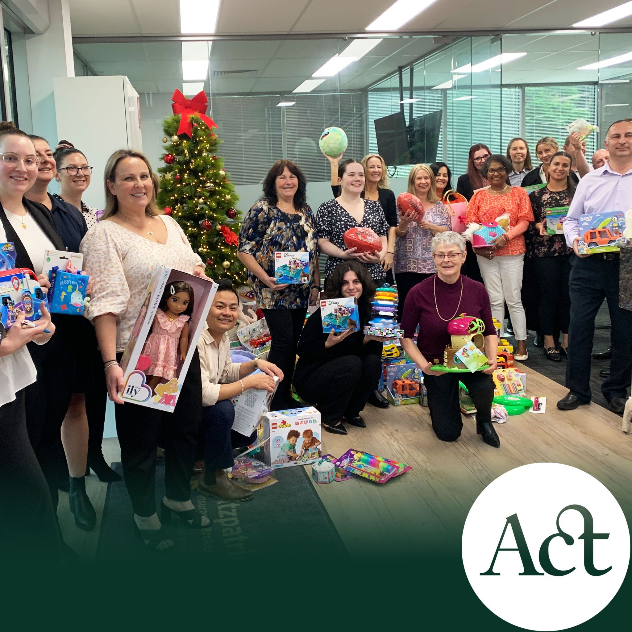 Staff around Christmas tree