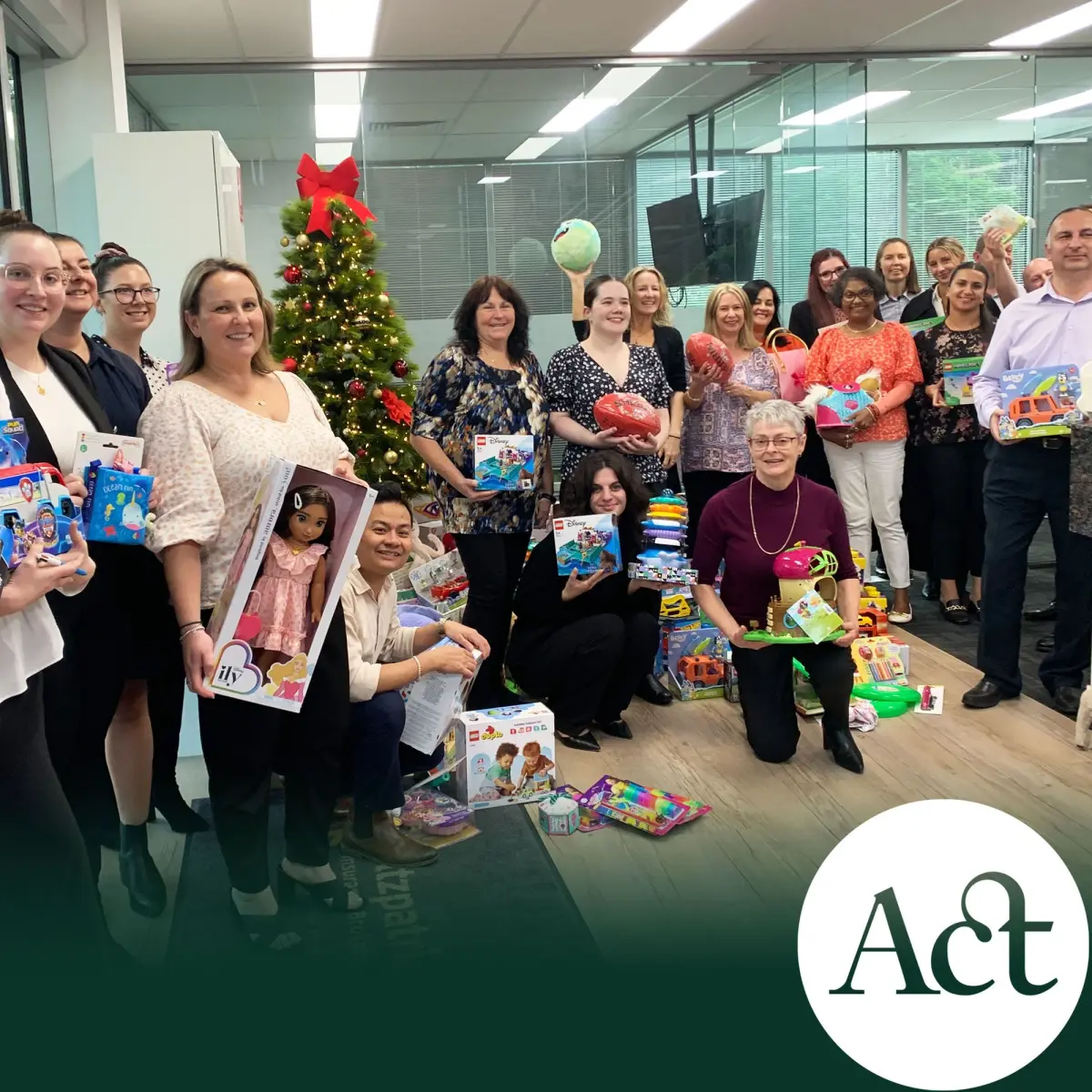 Staff around Christmas tree