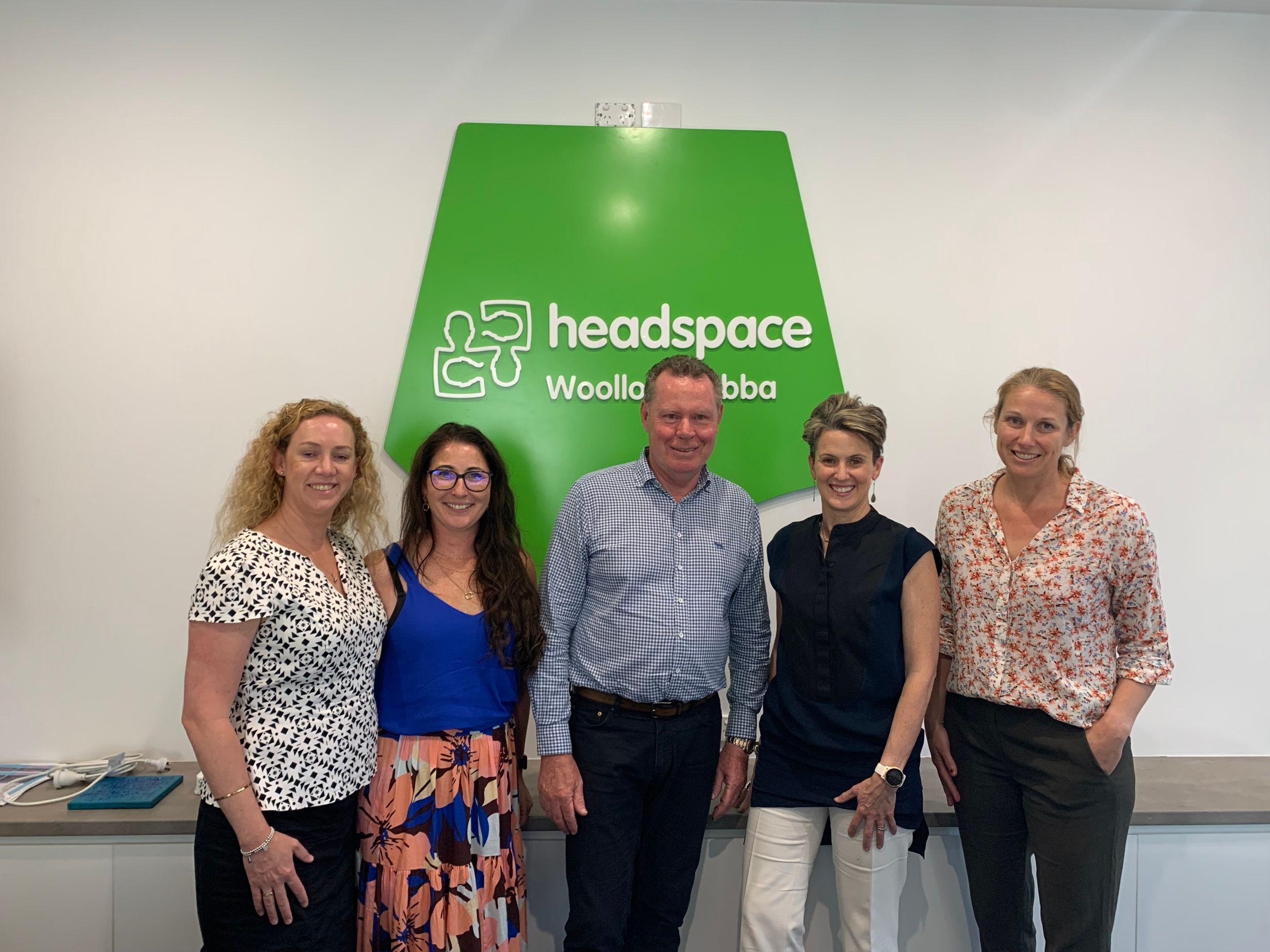 Envest chairman Paul Lynam (middle) with representatives from headspace and Envest to sign the new partnership deal